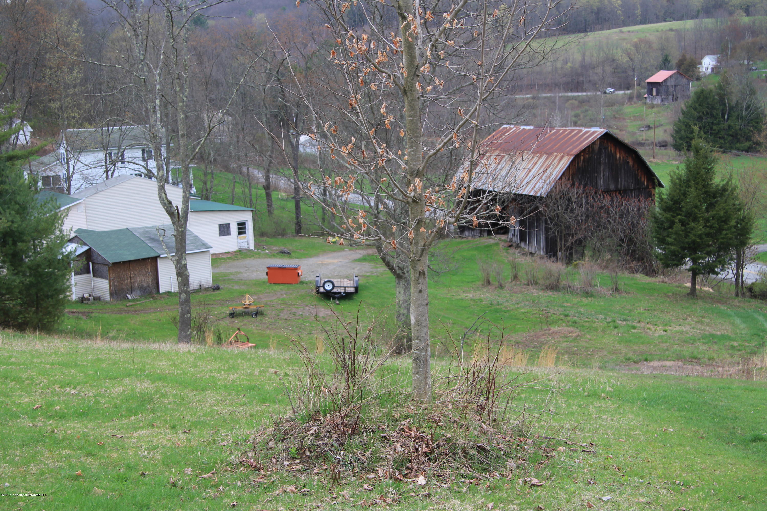 155 Blossom Road Nicholson, PA 18446 - Photo 29 of 35 a backyard of a house with table and chairs
