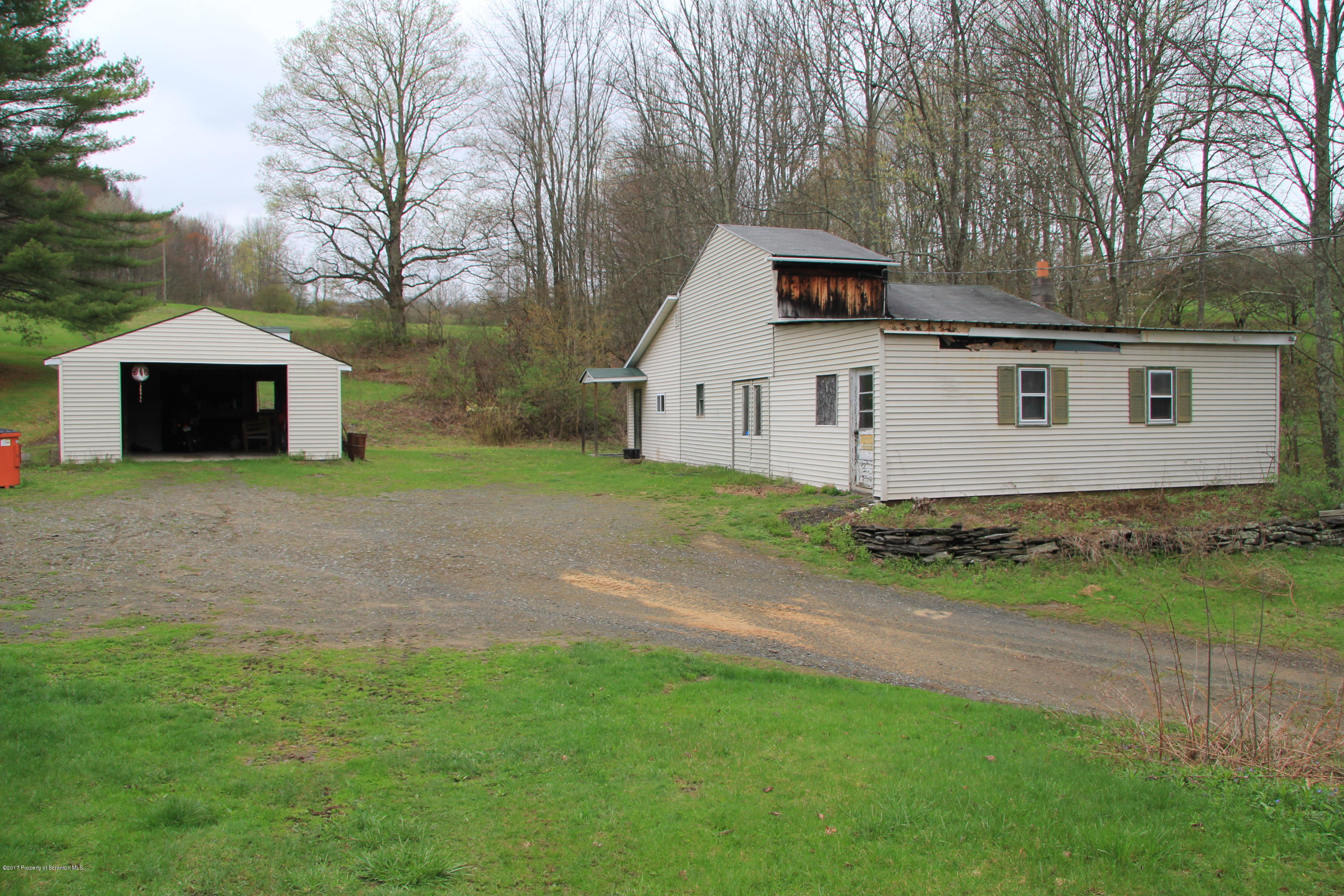 155 Blossom Road Nicholson, PA 18446 - Photo 34 of 35 a front view of a house with garden
