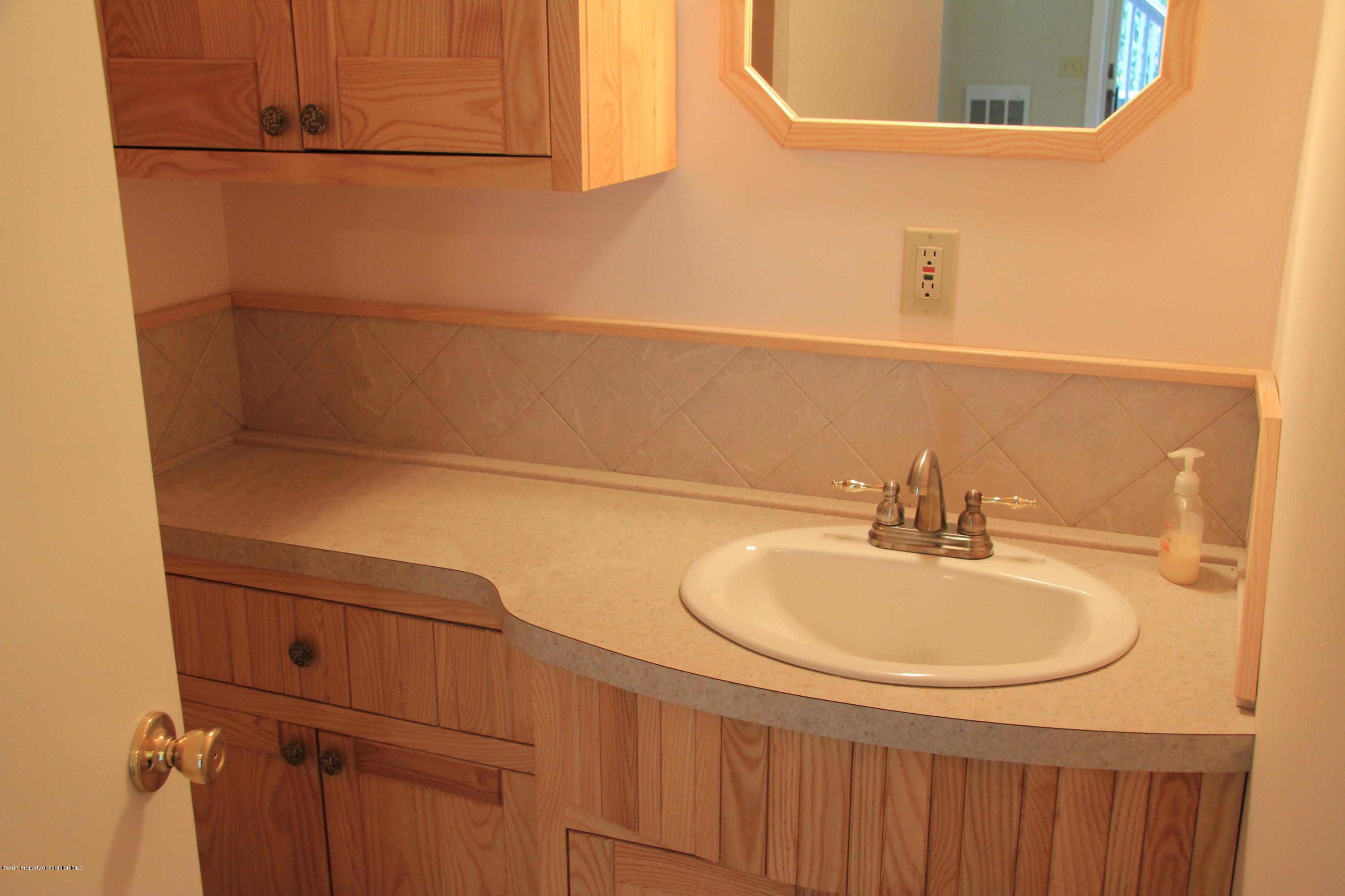 155 Blossom Road Nicholson, PA 18446 - Photo 9 of 35 a bathroom with a sink and a mirror