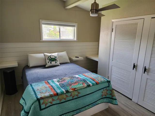 a bedroom with a bed and window