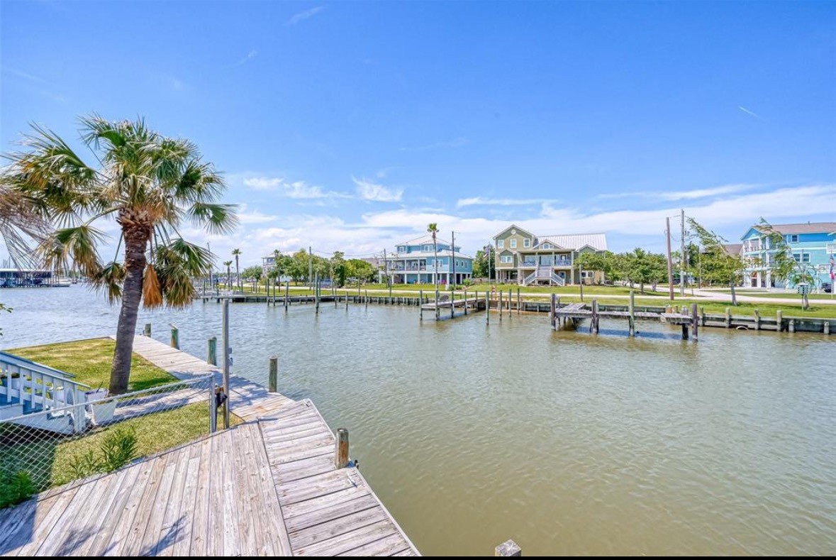 21 Tindel Street Clear Lake Shores, TX 77565 - Photo 10 of 12 a view of a lake with a table and chairs