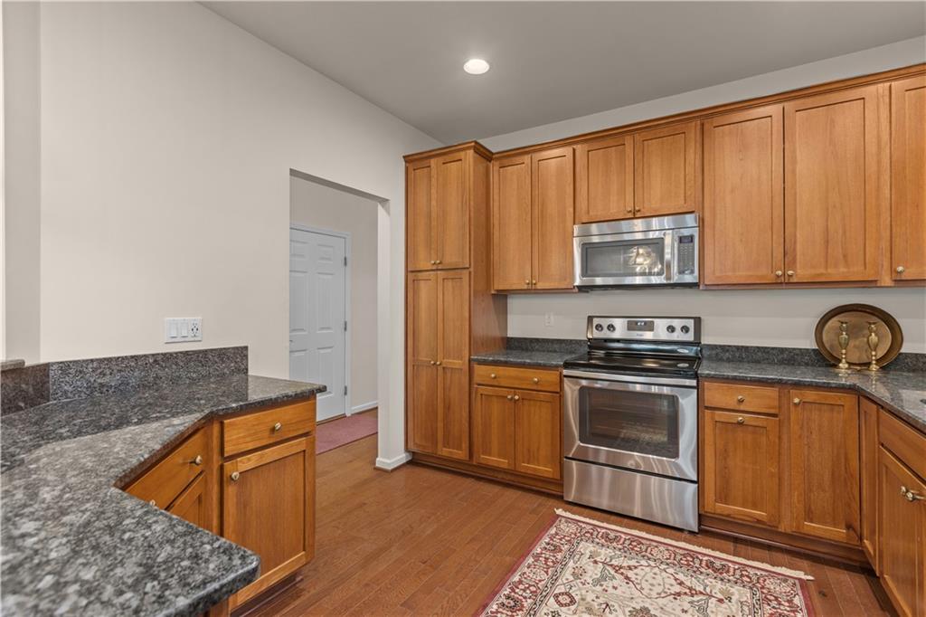 137 Freedom Lane Sewickley, PA 15143 - Photo 11 of 36 a kitchen with stainless steel appliances granite countertop a stove a sink and a microwave