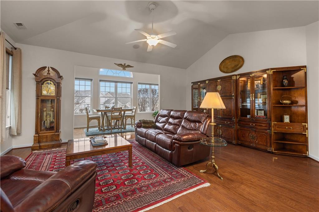 137 Freedom Lane Sewickley, PA 15143 - Photo 13 of 36 a living room with furniture a rug and a floor to ceiling window