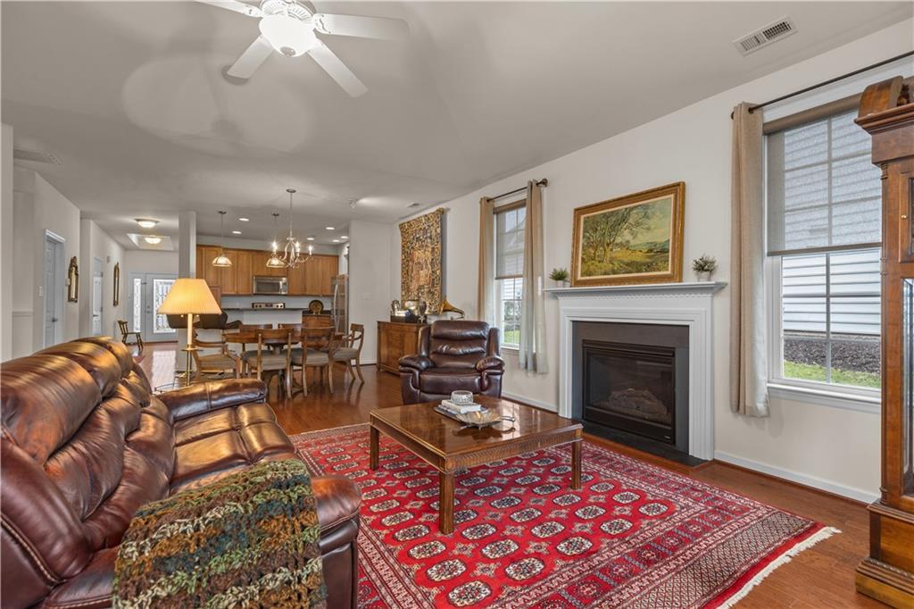 137 Freedom Lane Sewickley, PA 15143 - Photo 15 of 36 a living room with furniture a chandelier and a fireplace