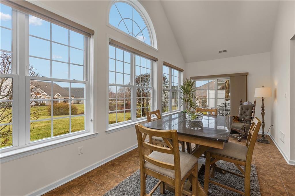 137 Freedom Lane Sewickley, PA 15143 - Photo 17 of 36 a dining room with furniture a chandelier and wooden floor