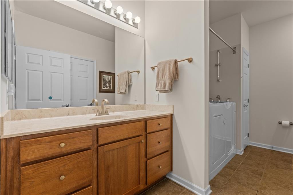 137 Freedom Lane Sewickley, PA 15143 - Photo 21 of 36 a bathroom with a granite countertop sink mirror and double