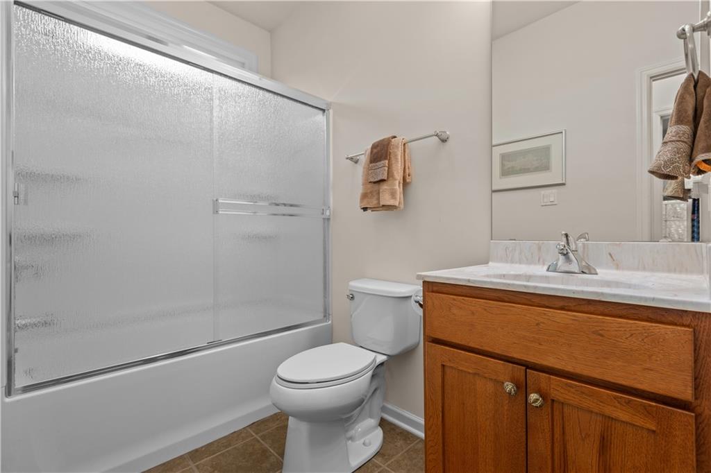 137 Freedom Lane Sewickley, PA 15143 - Photo 24 of 36 a bathroom with a sink a toilet and shower