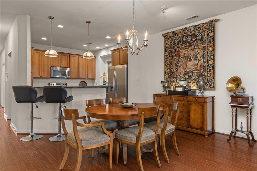 137 Freedom Lane Sewickley, PA 15143 - Photo 8 of 36 a view of a dining room with furniture and wooden floor