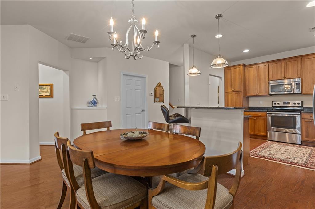137 Freedom Lane Sewickley, PA 15143 - Photo 9 of 36 a view of a dining room with furniture and wooden floor