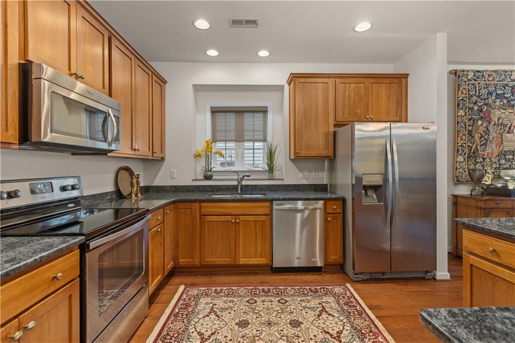 137 Freedom Lane Sewickley, PA 15143 - Photo 10 of 36 a kitchen with stainless steel appliances granite countertop a refrigerator a stove a sink and a microwave