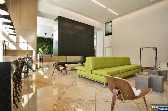 a living room with furniture and a rug