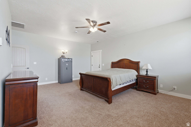 2567 West Rim Rock Drive Stockton, UT 84071 - Photo 24 of 64 Spacious interior room featuring light-colored walls and textured carpeting
