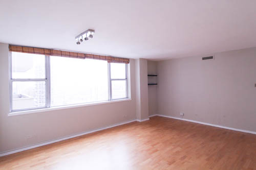 6301 North Sheridan Road, Unit 19A Chicago, IL 60660 - Photo 11 of 24 an empty room with a window