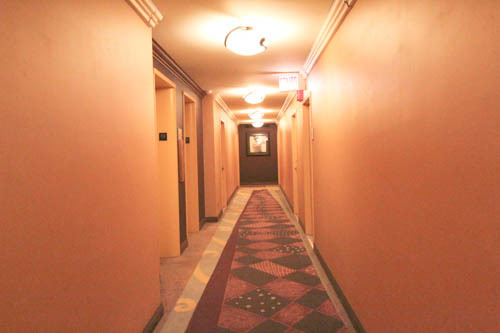 6301 North Sheridan Road, Unit 19A Chicago, IL 60660 - Photo 13 of 24 a view of a hallway with a door and a window