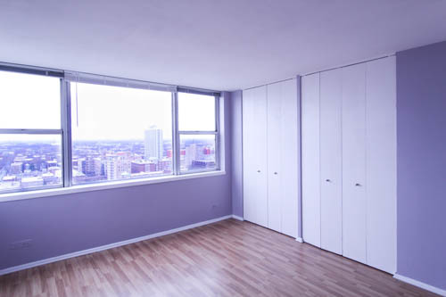 6301 North Sheridan Road, Unit 19A Chicago, IL 60660 - Photo 6 of 24 a view of empty room with wooden floor and fan