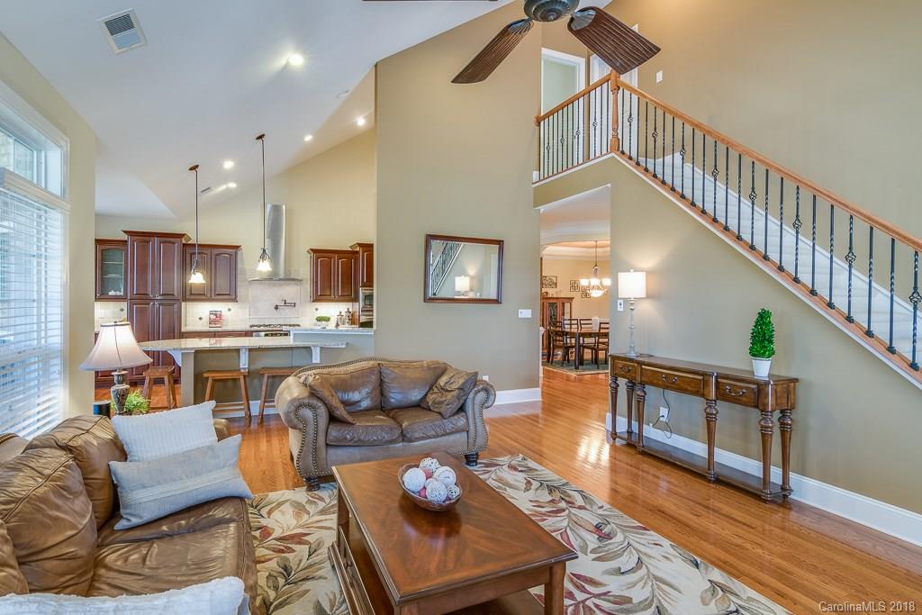 1770 Verdict Ridge Drive Denver, NC 28037 - Photo 1 of 36 a living room with furniture kitchen view and a wooden floor