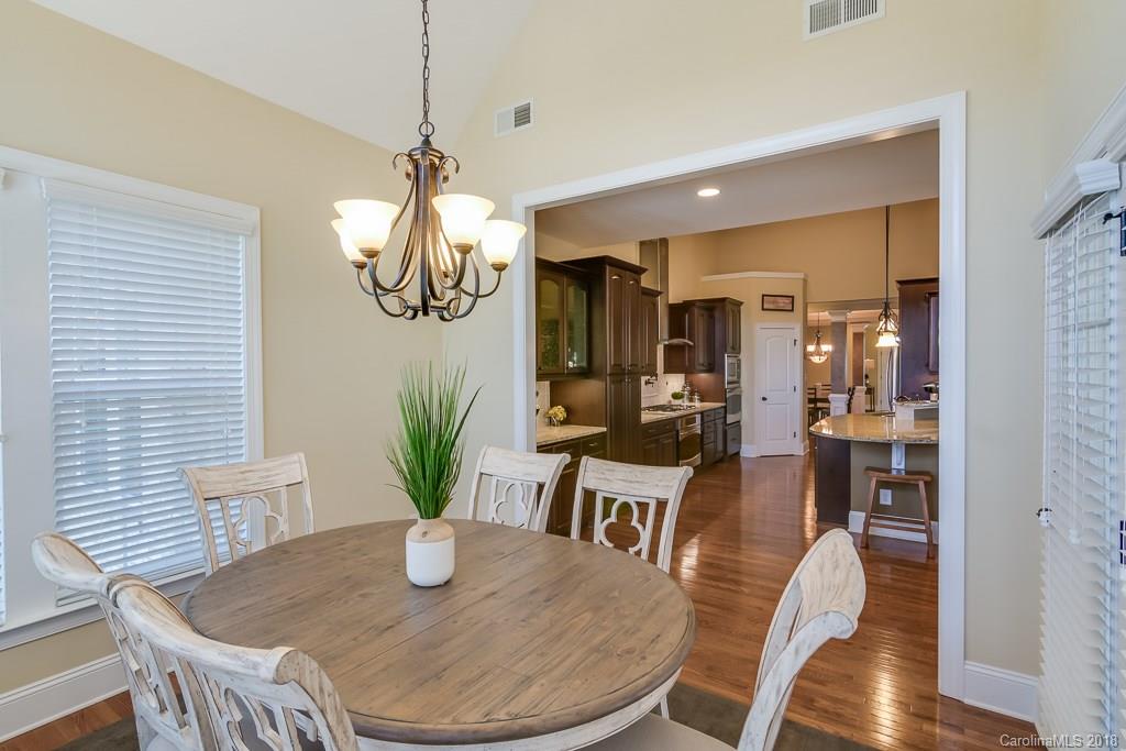 1770 Verdict Ridge Drive Denver, NC 28037 - Photo 16 of 36 a view of a dining room with furniture wooden floor and chandelier