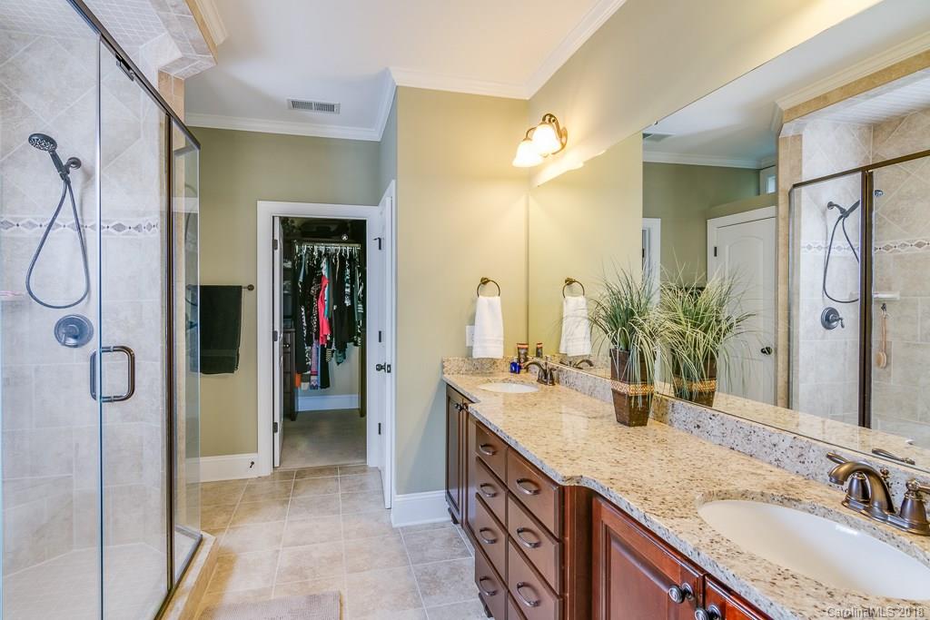 1770 Verdict Ridge Drive Denver, NC 28037 - Photo 19 of 36 a bathroom with a double vanity sink and a mirror