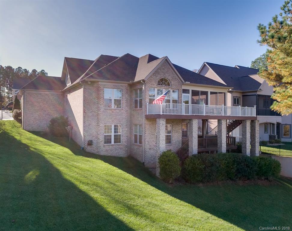 1770 Verdict Ridge Drive Denver, NC 28037 - Photo 3 of 36 a view of a big house with a big yard and large trees