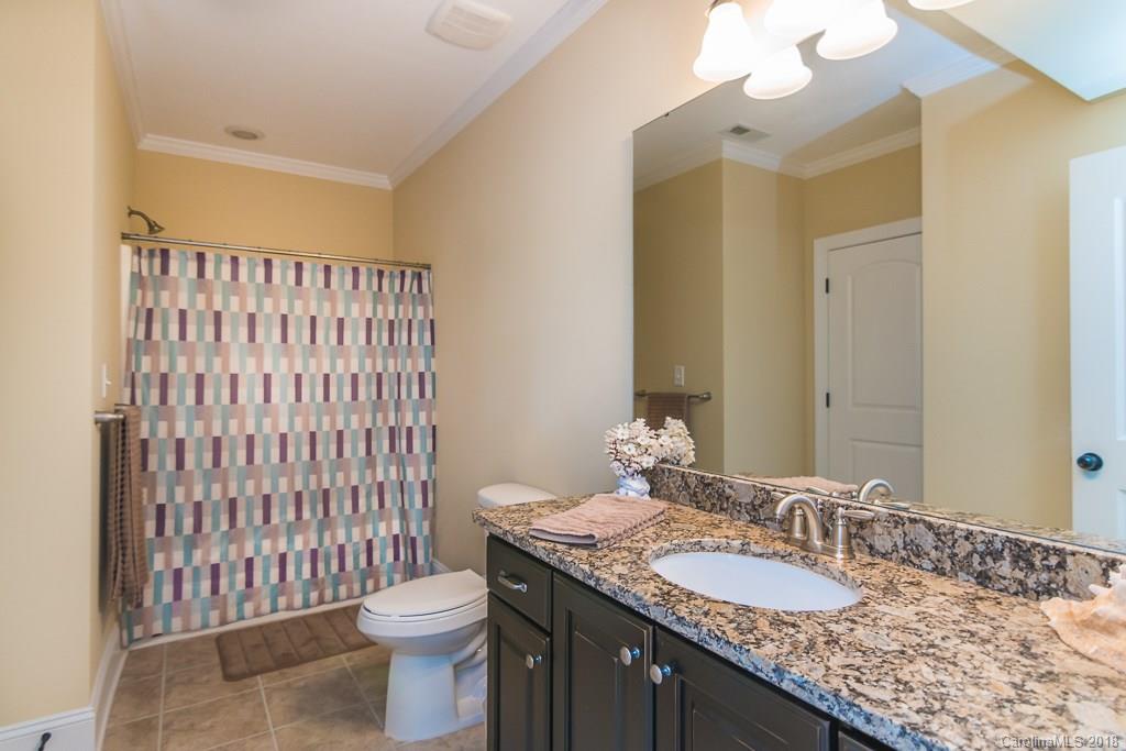 1770 Verdict Ridge Drive Denver, NC 28037 - Photo 21 of 36 a bathroom with a granite countertop sink toilet and shower