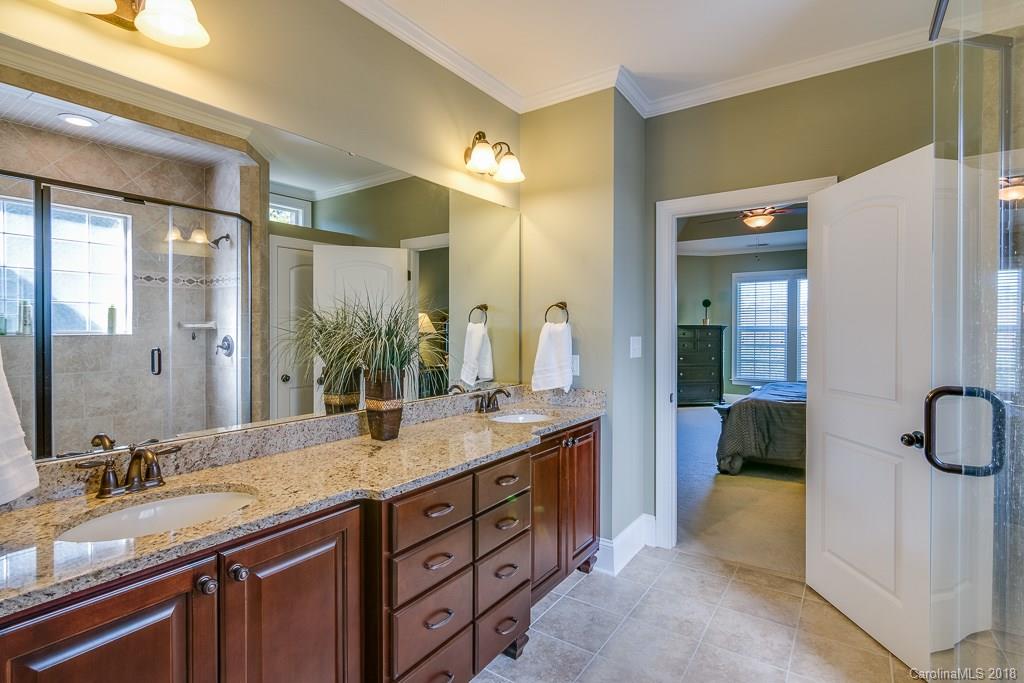 1770 Verdict Ridge Drive Denver, NC 28037 - Photo 23 of 36 a bathroom with a granite countertop sink and a mirror