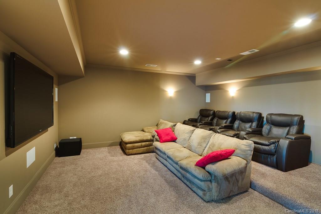 1770 Verdict Ridge Drive Denver, NC 28037 - Photo 27 of 36 a living room with furniture and a flat screen tv