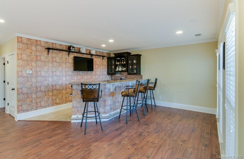 1770 Verdict Ridge Drive Denver, NC 28037 - Photo 28 of 36 a living room with furniture and a flat screen tv