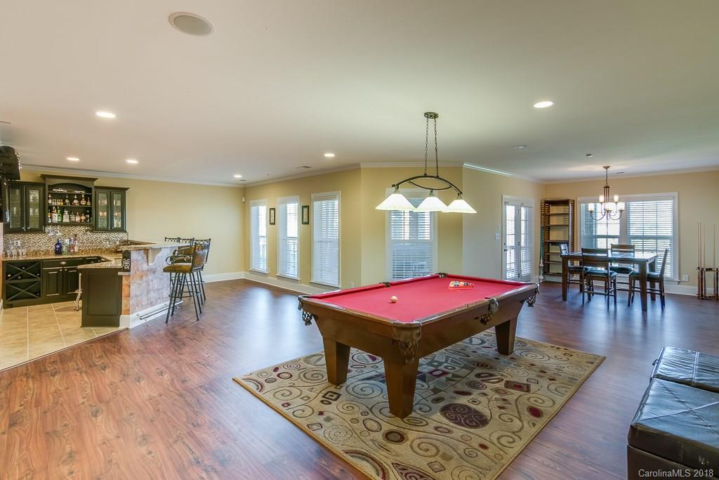 1770 Verdict Ridge Drive Denver, NC 28037 - Photo 30 of 36 an open kitchen with a table chairs and a living room