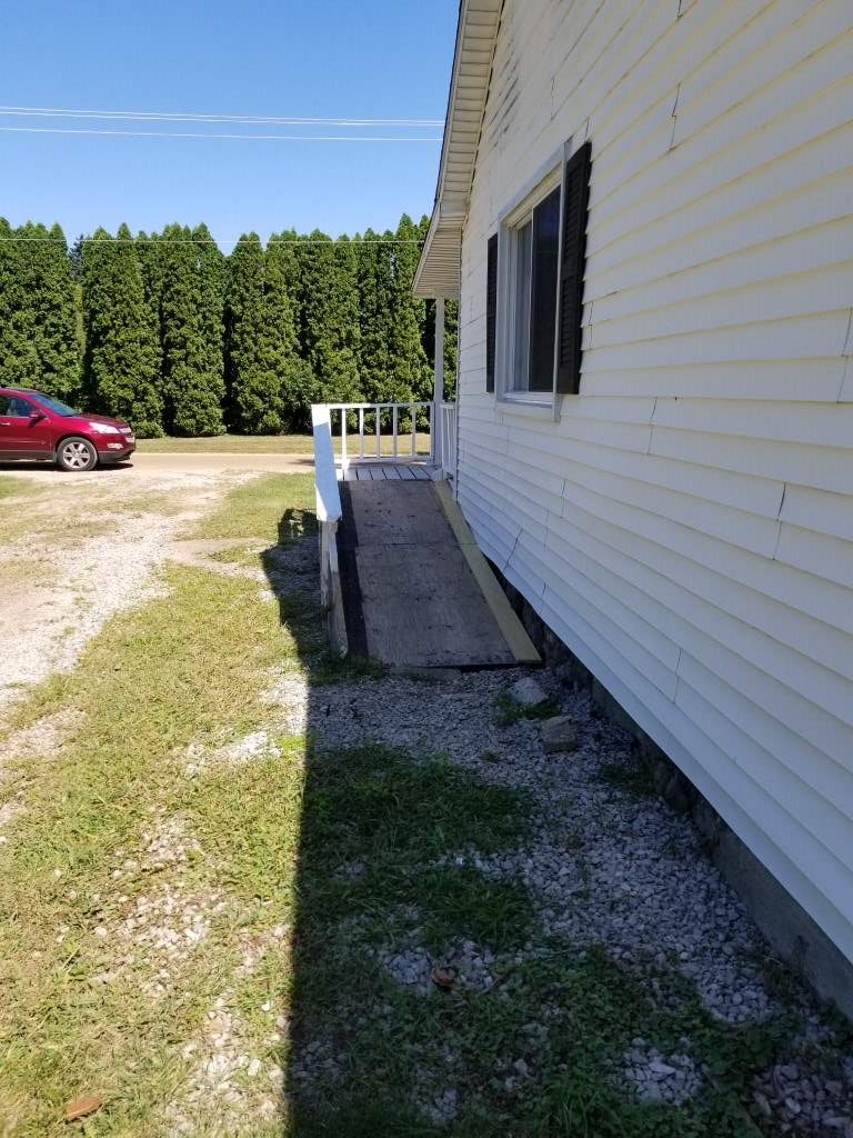 4850 Mill Road Bancroft, MI 48414 - Photo 19 of 25 East side of the home viewing the Bilco Doors