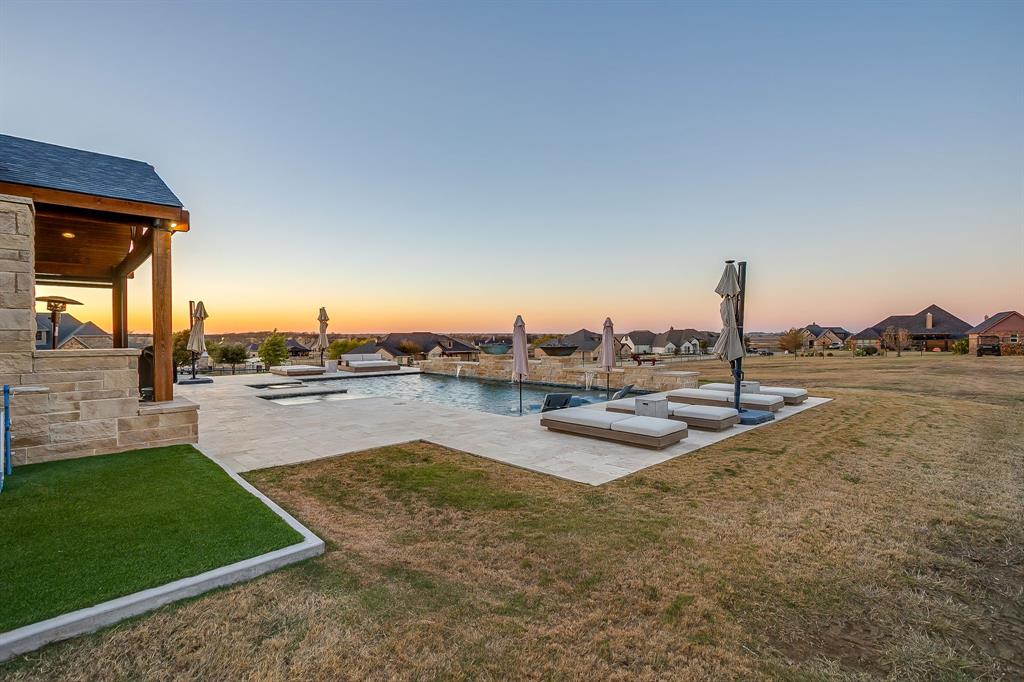 7320 Spring Ranch Court Godley, TX 76044 - Photo 31 of 38 a view of a lake with a house