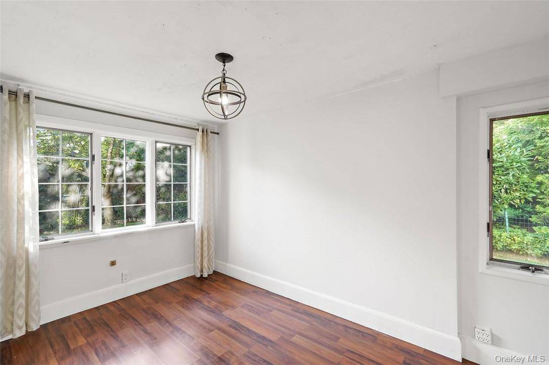246 Mamaroneck Road Scarsdale, NY 10583 - Photo 20 of 35 Bonus room / Home office on first floor featuring a wealth of natural light and dark wood finished floors
