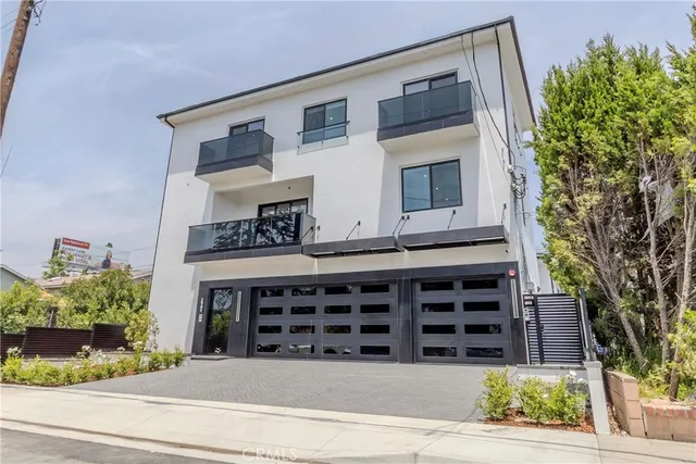 a view of front door and potted plants