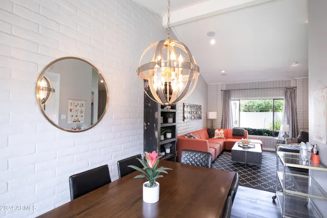 a living room with fireplace furniture and a chandelier