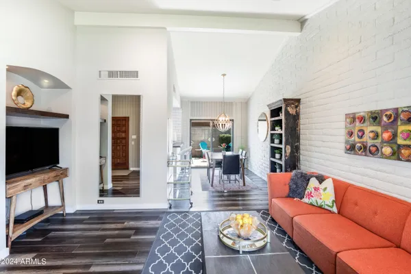 a living room with furniture and a window