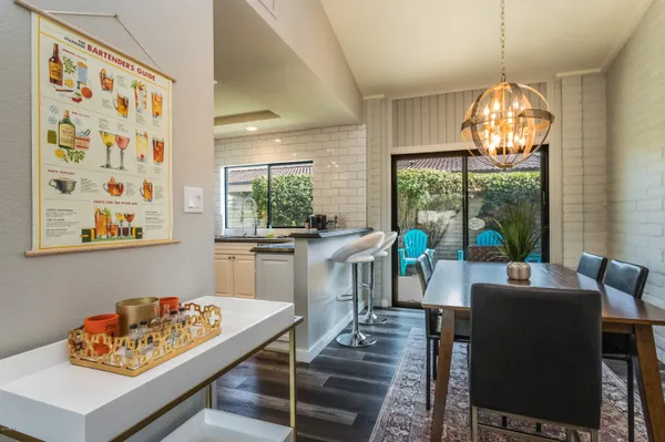 a kitchen with stainless steel appliances granite countertop a stove and a wooden floors