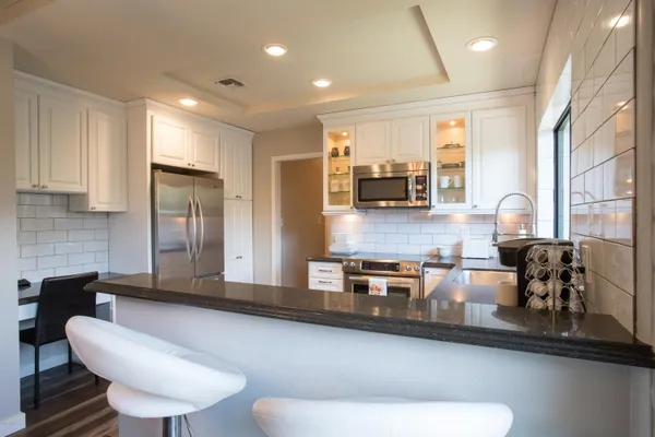a kitchen with a stove and a microwave