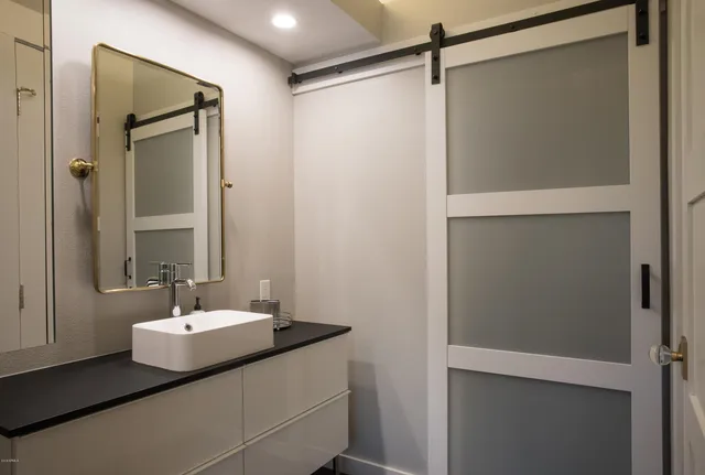 a view of a chairs and table in patio