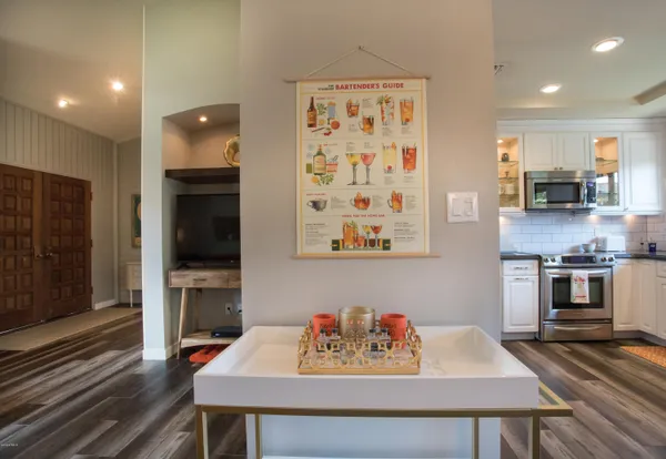 a kitchen with a table and chairs in it