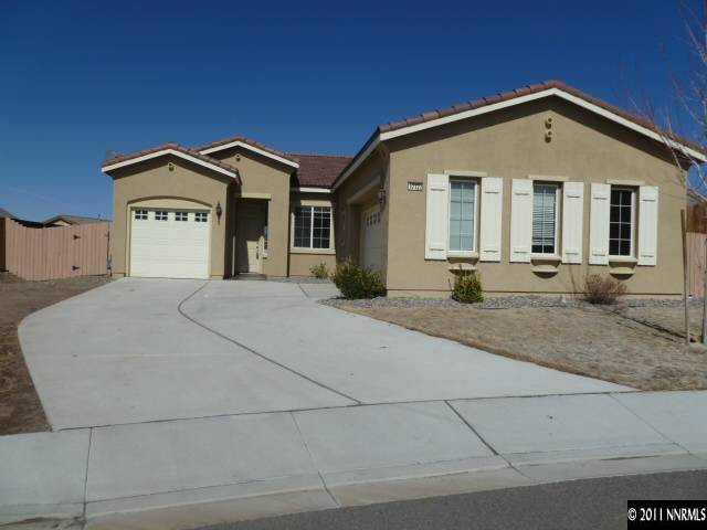 10122 Golden Spur Court Reno, NV 89521 - Photo 1 of 13 a front view of a house with a yard