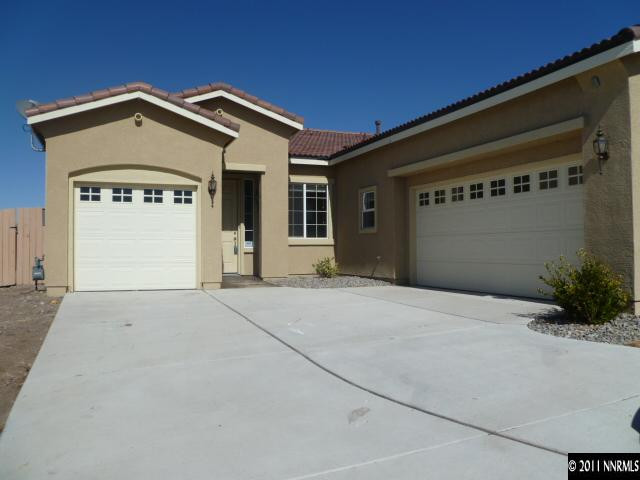 10122 Golden Spur Court Reno, NV 89521 - Photo 13 of 13 a front view of a house with a garage