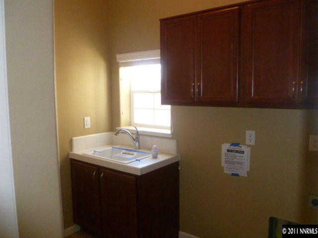 10122 Golden Spur Court Reno, NV 89521 - Photo 10 of 13 a bathroom with a sink a vanity and a window