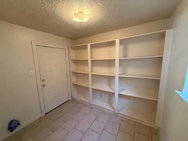 a view of an empty room with empty racks