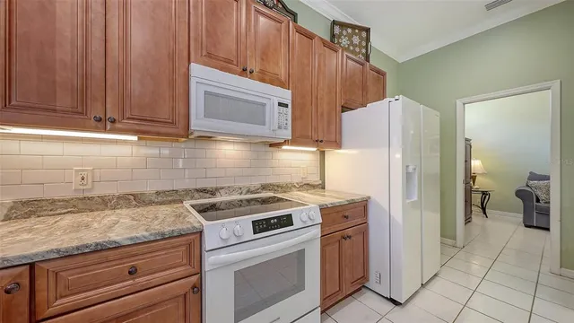 a bedroom with a bed and a dresser with mirror