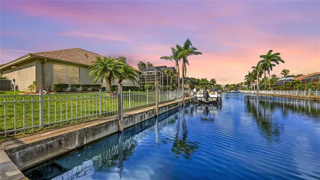 a dining room with furniture and a chandelier