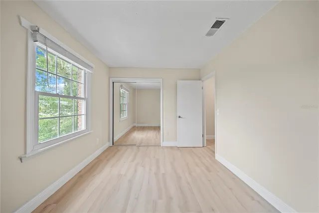 a view of a porch with a table and chairs