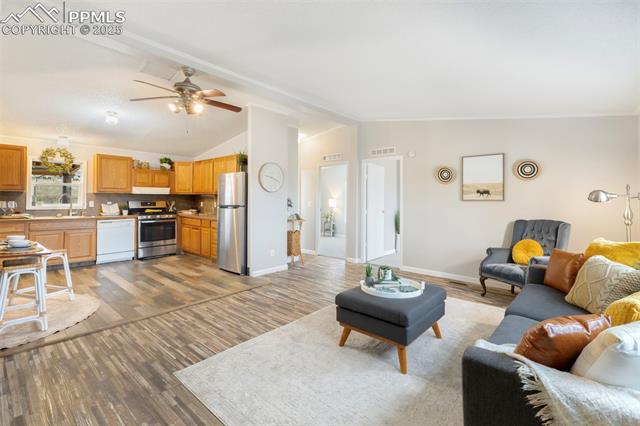 15345 Trigger Road Peyton, CO 80831 - Photo 26 of 26 Open floorplan featuring inviting living room and kitchen
