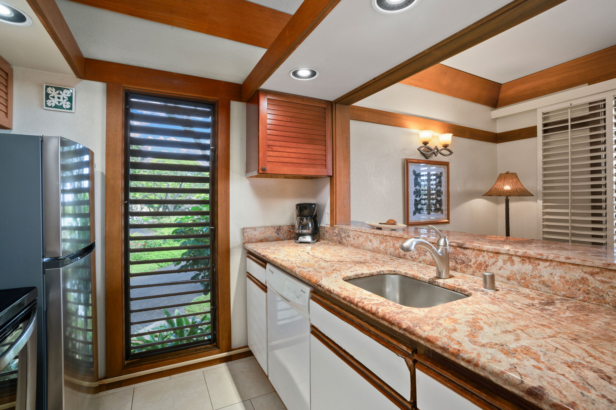 2253 Poipu Road, Unit 330 Koloa, HI 96756 - Photo 4 of 26 a kitchen with a sink and a window