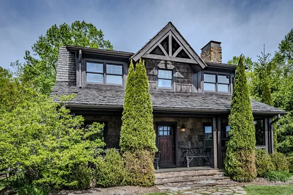 a front view of a house with garden