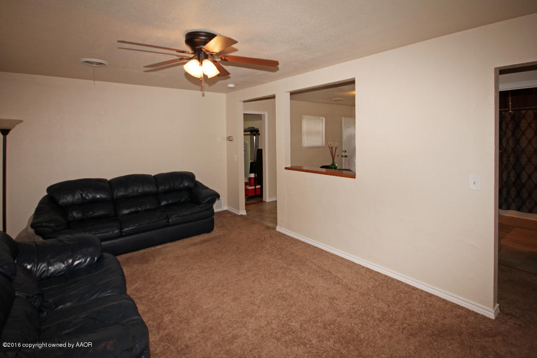 4111 Cline Road Amarillo, TX 79110 - Photo 3 of 16 a living room with furniture and a ceiling fan