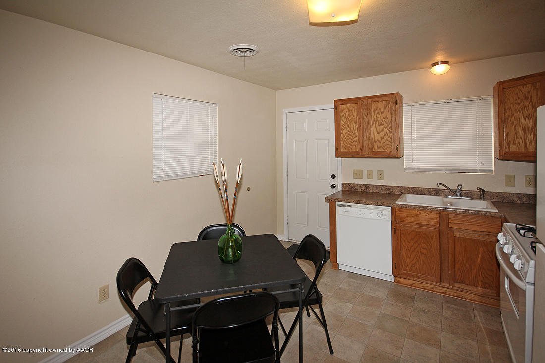 4111 Cline Road Amarillo, TX 79110 - Photo 8 of 16 a view of a workspace with furniture and a potted plant